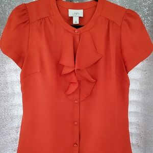 Orange blouse with frills